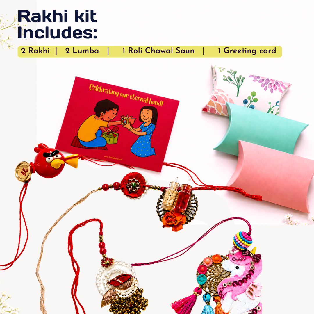 Rakhi gift kit contents arranged on a white background with text reading 'Rakhi kit Includes:'. Visible items include two red Rakhi threads with decorative charms, a red greeting card with an illustration, two pastel pillow boxes, and a small red Angry Birds charm.