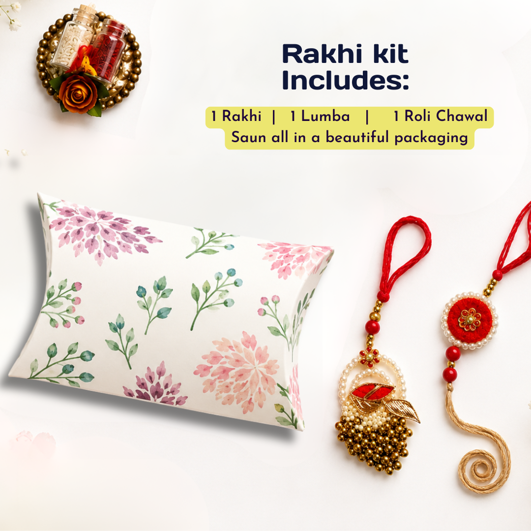 Rakhi gift set on a white background featuring a floral-patterned pillow, a red beaded Lamba, and a red beaded Roli Chawal, with text reading 'Rakhi kit Includes:'.