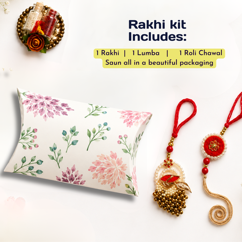 Rakhi gift set on a white background featuring a floral-patterned pillow, a red beaded Lamba, and a red beaded Roli Chawal, with text reading 'Rakhi kit Includes:'.