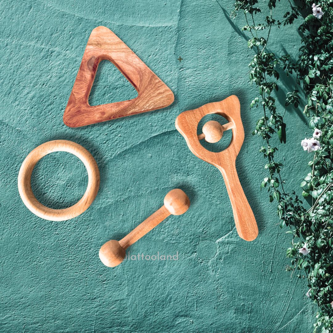 A beautifully arranged set of natural wooden teething rings, ideal for a baby's teething comfort and relief. wooden triangle wooden ring wooden dumbell wooden rattle for babies kids