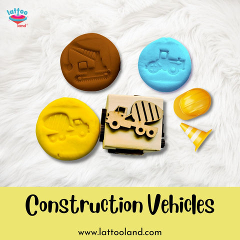 Hands-on learning activity with wooden construction vehicle stamp dice for children.