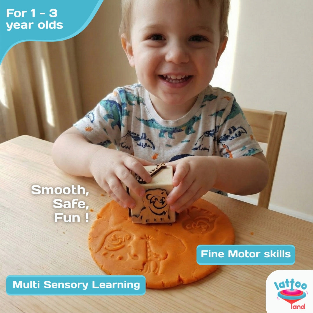 Child stamping forest animal shapes on play dough with wooden dice.