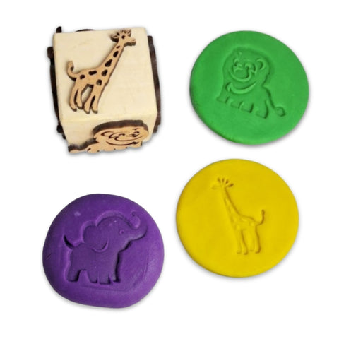 Wooden forest animals stamp dice for kids to use on play dough, paper, and cloth.