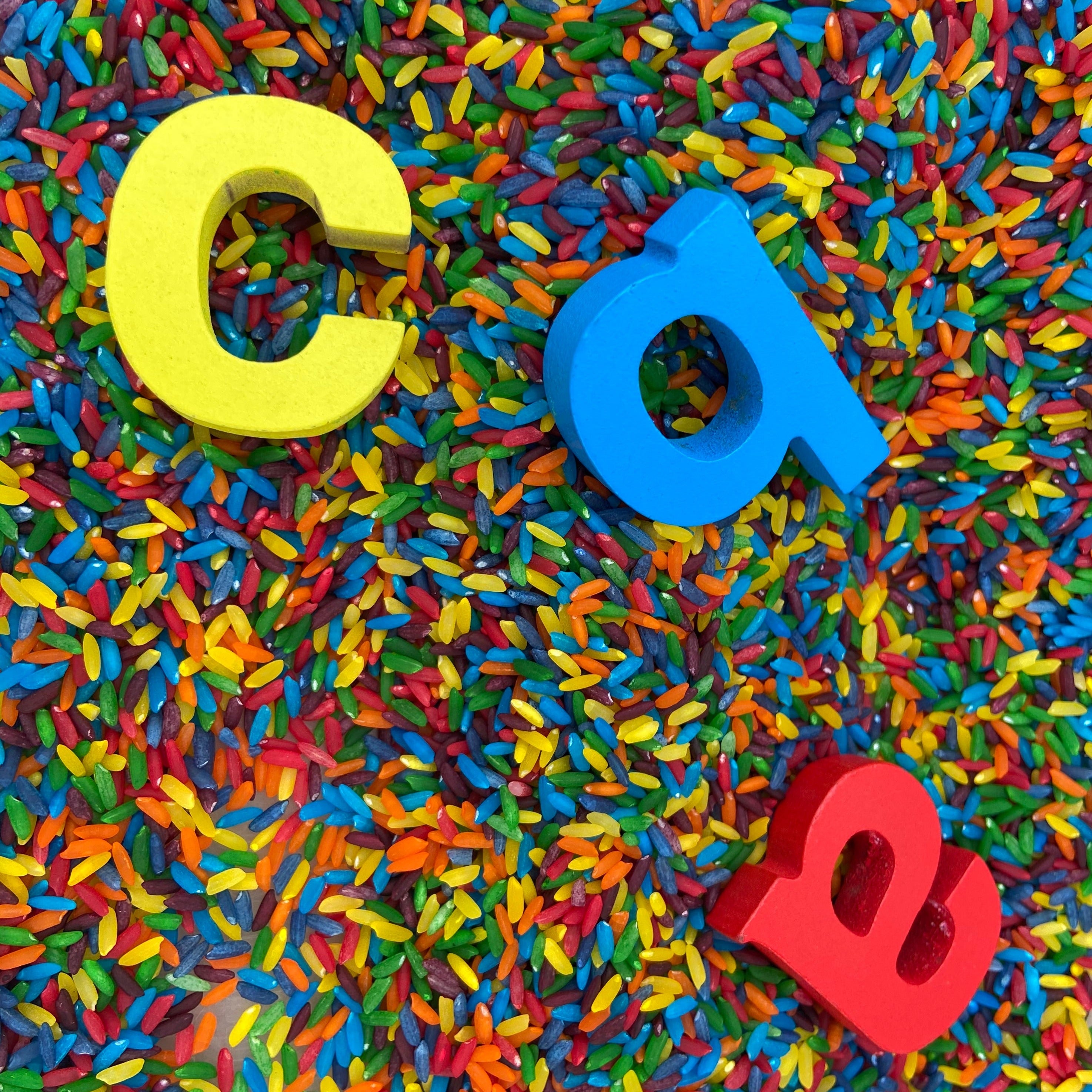 Sensory play set with rainbow rice, promoting hands-on learning, cognitive skills, and sensory engagement for kids.